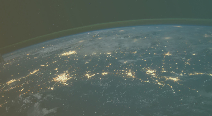 space view of earth with cities lit up