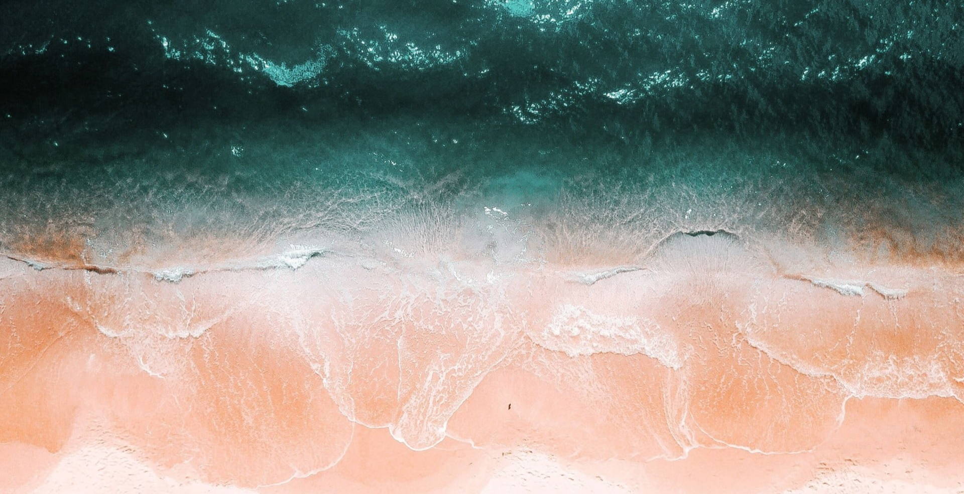 bird's view of peach and turquoise sea
